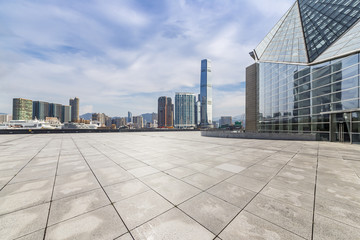 Fototapeta premium Panoramic skyline and modern business office buildings with empty road,empty concrete square floor