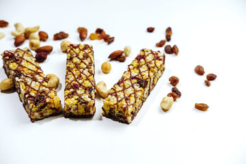 Granola bar. healthy sweet dessert snack. ?ereal granola bar with nuts, fruit and berries on white table. top view.