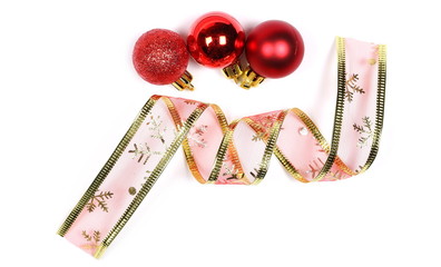 Christmas ornaments, decorated ribbon and red balls isolated on white background