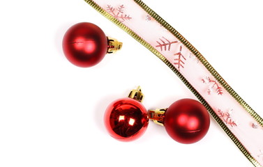 Christmas ornaments, decorated ribbon and red balls isolated on white background
