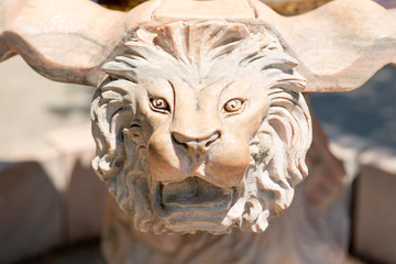 stone sculpture of lion's muzzle