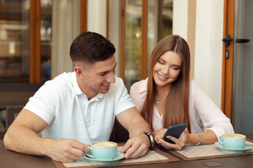 Two people in cafe enjoying the time spending with each other