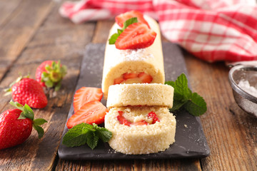 strawberry cake on wood background