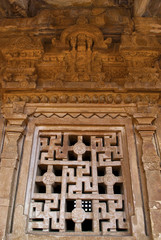 Carved window with the swastika design on the garbha griha wall, Aihole, Bagalkot, Karnataka. The Galaganatha Group of temples.