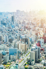 Fototapeta na wymiar Asia Business concept for real estate and corporate construction - panoramic modern city urban skyline bird eye aerial view under sun & blue sky in Tokyo, Japan