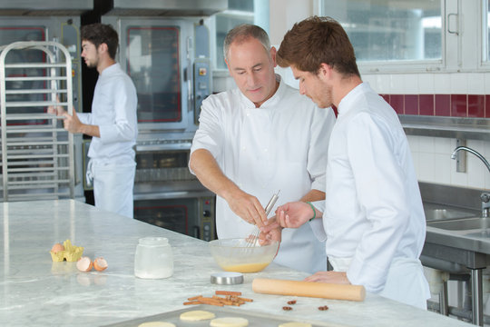 apprentices bakers in school kitchen
