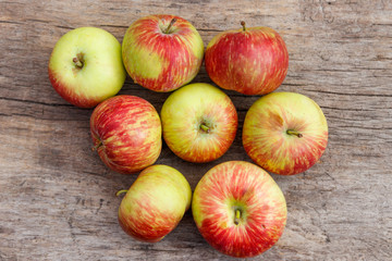 Fresh ripe apples on rustic wooden table