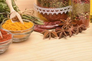 Various spices on wooden background.