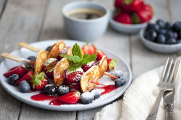 Traditional danish pancakes - ebelskivers with fresh berries