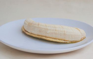 A banana on a plate. Candid.