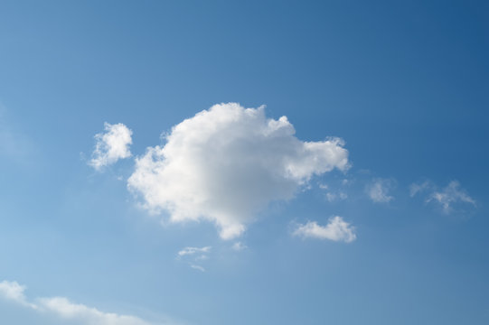 Blue sky with one white cloud background. Landscape sky.