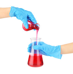Hands in medical gloves and flasks with reagents