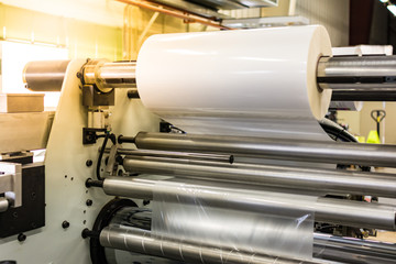 Matte or gloss plastic machine in a printing press for a perfect finish of printed documents.