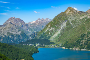 Naklejka na ściany i meble View of the Maloja pass in valley Engadine Switzerland. Beginning of the Inn River