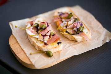 Bruschetta with olives, olive oil and jamon