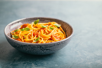 Italian pasta with tomato sauce in bowl