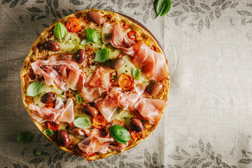 Italian pizza on rustic textile