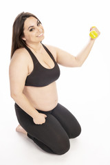 Young fat woman doing aerobic exercise