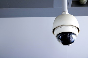 CCTV security camera operating in home. Image of CCTV security camera on background. CCTV ball on safe ground. 