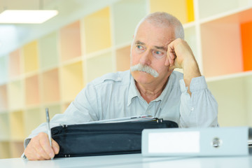 worried office worker analyzing his career path