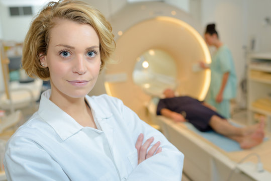 female doctor looking at camera in mri room of hospital