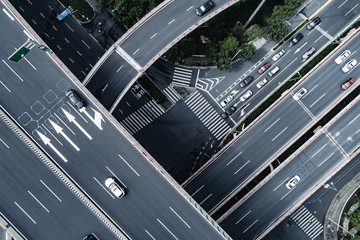 Aerial view of highway and overpass in city - obrazy, fototapety, plakaty