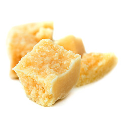 Pieces of parmesan cheese isolated on white background. Parmesan chunks  close up.