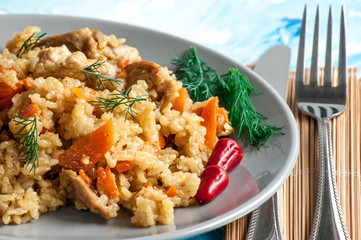 White rice with chicken, vegetables and herbs.