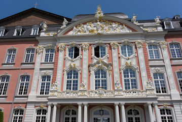 Fototapeta premium Street photography. Electoral Palace in Trier, Germany. The Electoral Palace directly next to the Basilika is considere done oft hemost beautiful rococo palaces in the world.