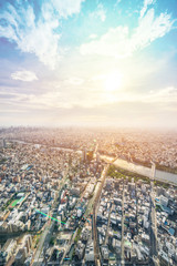 Asia Business concept for real estate and corporate construction - panoramic modern city urban skyline bird eye aerial view under sun & blue sky in Tokyo, Japan © voyata
