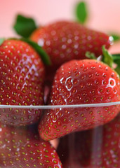 Macro closeup of bowl of fresh strawberries.