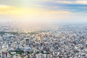 Asia Business concept for real estate and corporate construction - panoramic urban city skyline aerial view under twilight sky and golden sun in tokyo, Japan