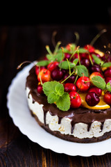 Cake with chocolate icing and fruit