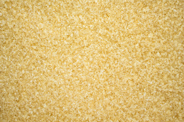 sugar cane brown on spoon and background