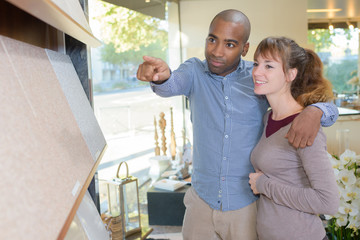 Fototapeta premium Couple choosing floor tiles