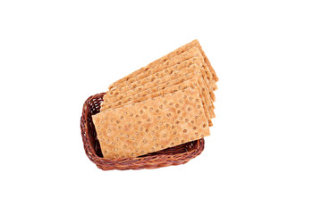 Buckwheat crisp bread in the basket. Isolated on a white background.