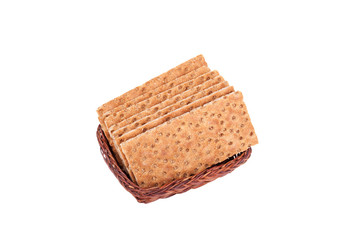 Buckwheat crisp bread in the basket. Isolated on a white background.