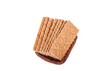 Buckwheat crisp bread in the basket. Isolated on a white background.