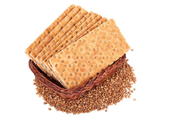 Buckwheat crisp bread in the basket. Isolated on a white background.