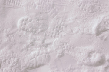 Footprints of people's shoes in the snow