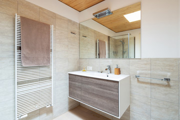 Modern bathroom with wood and marble finishes