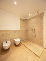 Fototapeta na wymiar Modern bathroom with wood and marble finishes