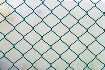 Iron grating  on the white wall background. Fence