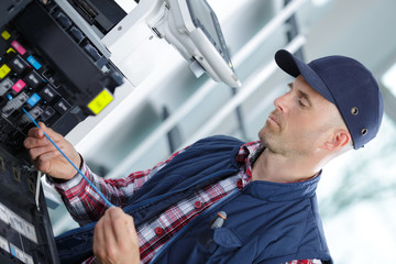 technician man repairing photocopy machine
