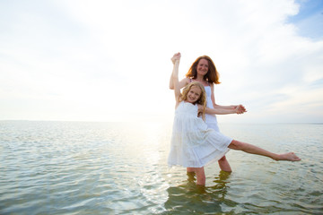 mother with daughter at the sea