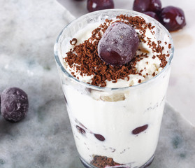 Ice cream with cherry berries on  marble countertop background