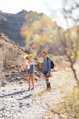Man and woman walking on a rocky path