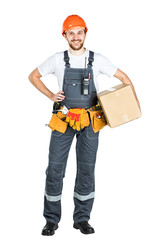 A man is a builder with a cardboard box in his hands. Isolated over white background.