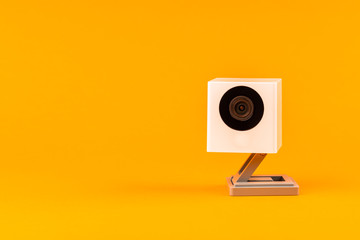 white webcam on orange background, object, Internet, technology concept