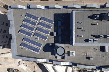 Solar panels on the roof of the multi-family houses, aerial view